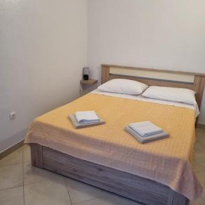 Postel nebo postele na pokoji v ubytování Apartments Luka