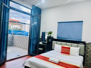 Postel nebo postele na pokoji v ubytování Phú Gia Hotel 99 Đường D1, KDC Him Lam, Tân Hưng, Quận7 + 37 fotografií