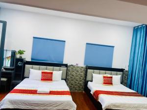 Postel nebo postele na pokoji v ubytování Phú Gia Hotel 99 Đường D1, KDC Him Lam, Tân Hưng, Quận7
