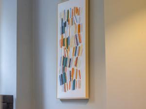 a painting hanging on a wall in a room at Pass the Keys Happy Haven Home, West End in Glasgow
