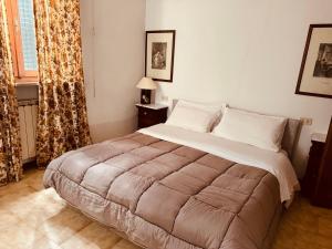 Voodi või voodid majutusasutuse Hotel Le Logge toas