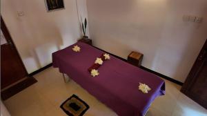 Ένα ή περισσότερα κρεβάτια σε δωμάτιο στο Harmony Haven Ayurvedic Luxury Spa