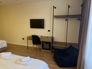 Postel nebo postele na pokoji v ubytování Andi Downtown Deluxe Rooms