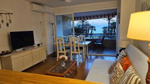 a living room with a couch and a table at Almuñécar Velilla Sea View in Almuñécar