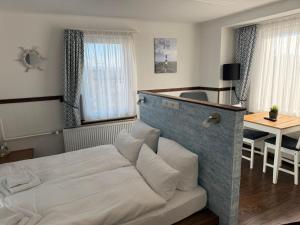 Postel nebo postele na pokoji v ubytování Hotel Schöne Aussicht