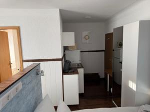 Kuchyň nebo kuchyňský kout v ubytování Hotel Schöne Aussicht
