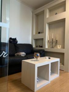 a living room with a coffee table and a couch at V A z A T A apartment in Ruse
