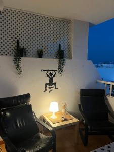 Posezení v ubytování Appart Cosy vue piscine, wifi, à 500 m plage