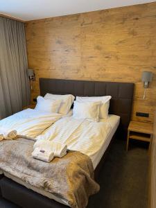Łóżko lub łóżka w pokoju w obiekcie Chalet Lenzi