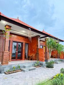 a brick house with a patio in front of it at South Hill Pandawa in Nusa Dua