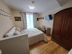 Postel nebo postele na pokoji v ubytování Il Geranio B&B