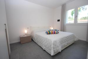 A bed or beds in a room at Residenza Due Perle