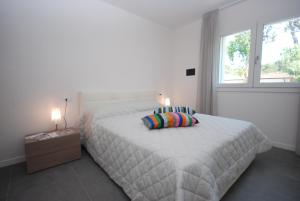 A bed or beds in a room at Residenza Due Perle