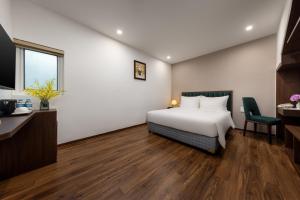 Voodi või voodid majutusasutuse Hanoi Vista Hotel toas