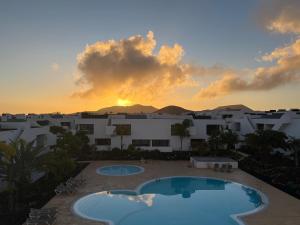 a view of the sunset from the balcony of a resort at Sunset Apartment at Casilla de Costa in Villaverde