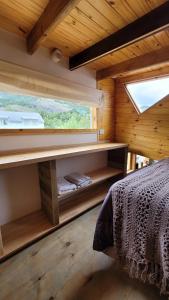 Postel nebo postele na pokoji v ubytování Klettern Tiny House - Lo de Juan
