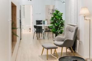 Posezení v ubytování Lujoso y amplio apartamento con parking incluido + 21 fotografií