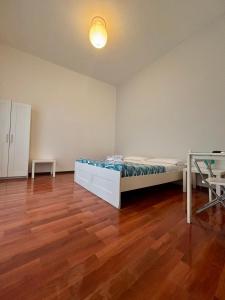 A bed or beds in a room at Castelnuovo Rooms #Politeama