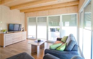 TV a/nebo společenská místnost v ubytování Ferienhaus 4 Wolfsschlucht