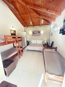 a bedroom with a bed and two bunk beds at PEDRO NAVARINO VII Laganas in Laganas +35 photos