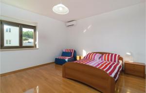 Posteľ alebo postele v izbe v ubytovaní Two-Bedroom Apartment In Bol