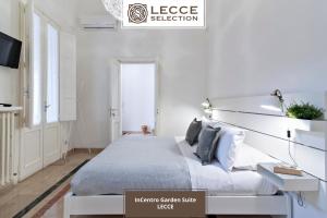 Postel nebo postele na pokoji v ubytování InCentro Comfort Suite - Lecce Selection
