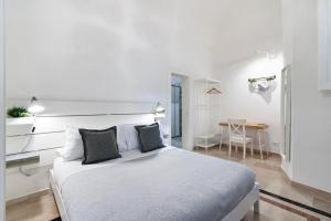 Postel nebo postele na pokoji v ubytování InCentro Comfort Suite - Lecce Selection