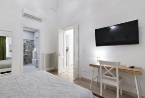 Telewizja i/lub zestaw kina domowego w obiekcie InCentro Comfort Suite - Lecce Selection
