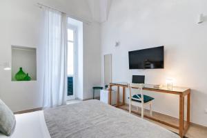 Telewizja i/lub zestaw kina domowego w obiekcie InCentro Comfort Suite - Lecce Selection