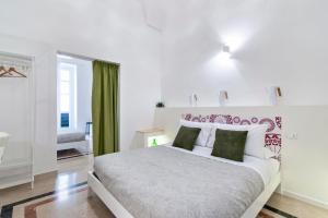 Łóżko lub łóżka w pokoju w obiekcie InCentro Comfort Suite - Lecce Selection