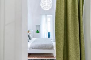 Łóżko lub łóżka w pokoju w obiekcie InCentro Comfort Suite - Lecce Selection