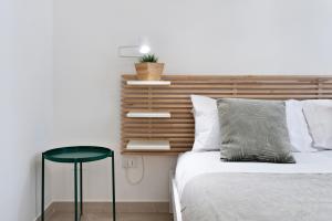 Łóżko lub łóżka w pokoju w obiekcie InCentro Comfort Suite - Lecce Selection