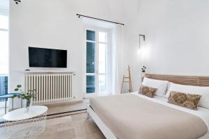 Telewizja i/lub zestaw kina domowego w obiekcie InCentro Comfort Suite - Lecce Selection