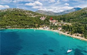 an aerial view of a beach with a boat in the water at Holiday Home Sladenovici Iv in Slano