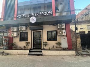 a hotel silver moon with speakers on the building at Hotel Silver Moon-200 meter Jaipur Junction in Jaipur