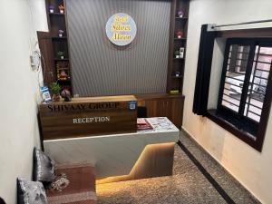 a shop with a shimmy group register in a room at Hotel Silver Moon-200 meter Jaipur Junction in Jaipur