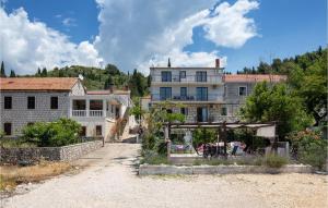 a group of buildings on a dirt road at Apartment Blace Bartulovici Iii in Blace