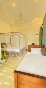 a bedroom with two bunk beds in a room at Simplex Sea Place in Tangalle