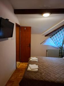 Postel nebo postele na pokoji v ubytování Hotel Koliba na Grza