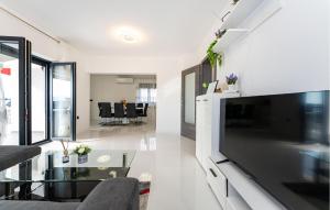 a living room with a large flat screen tv at Stunning Home In Maslenica With Wifi in Maslenica
