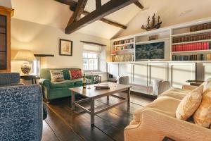 a living room with two couches and a table at High Lindeth in Bowness-on-Windermere