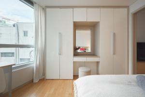 Postel nebo postele na pokoji v ubytování Urban Studio