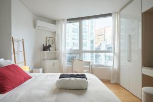 Postel nebo postele na pokoji v ubytování Urban Studio
