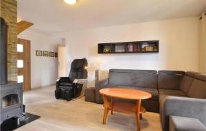 a living room with a couch and a table at 3 Bedroom Lovely Home In Karpacz in Karpacz +8 photos