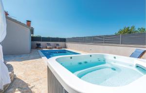 a large hot tub on the side of a house at 2 Bedroom Gorgeous Home In Zadar in Zadar +31 photos