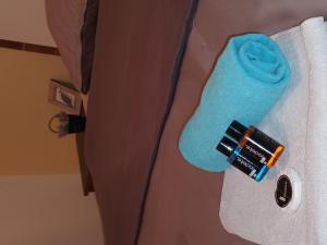 a robe with a blue sock and a toothbrush at Sarajevo Apartment by Didi 4U2STAY free parking in Sarajevo