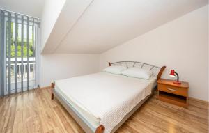 Posteľ alebo postele v izbe v ubytovaní Apartment Vojskovo Iii