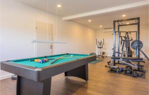 a living room with a pool table and a gym at Luxurious Home In Dicmo in Dicmo +39 photos
