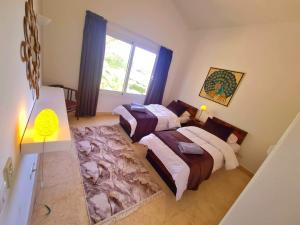 Postel nebo postele na pokoji v ubytování White villa
