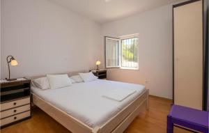 Postel nebo postele na pokoji v ubytování Holiday Home Podgora 14